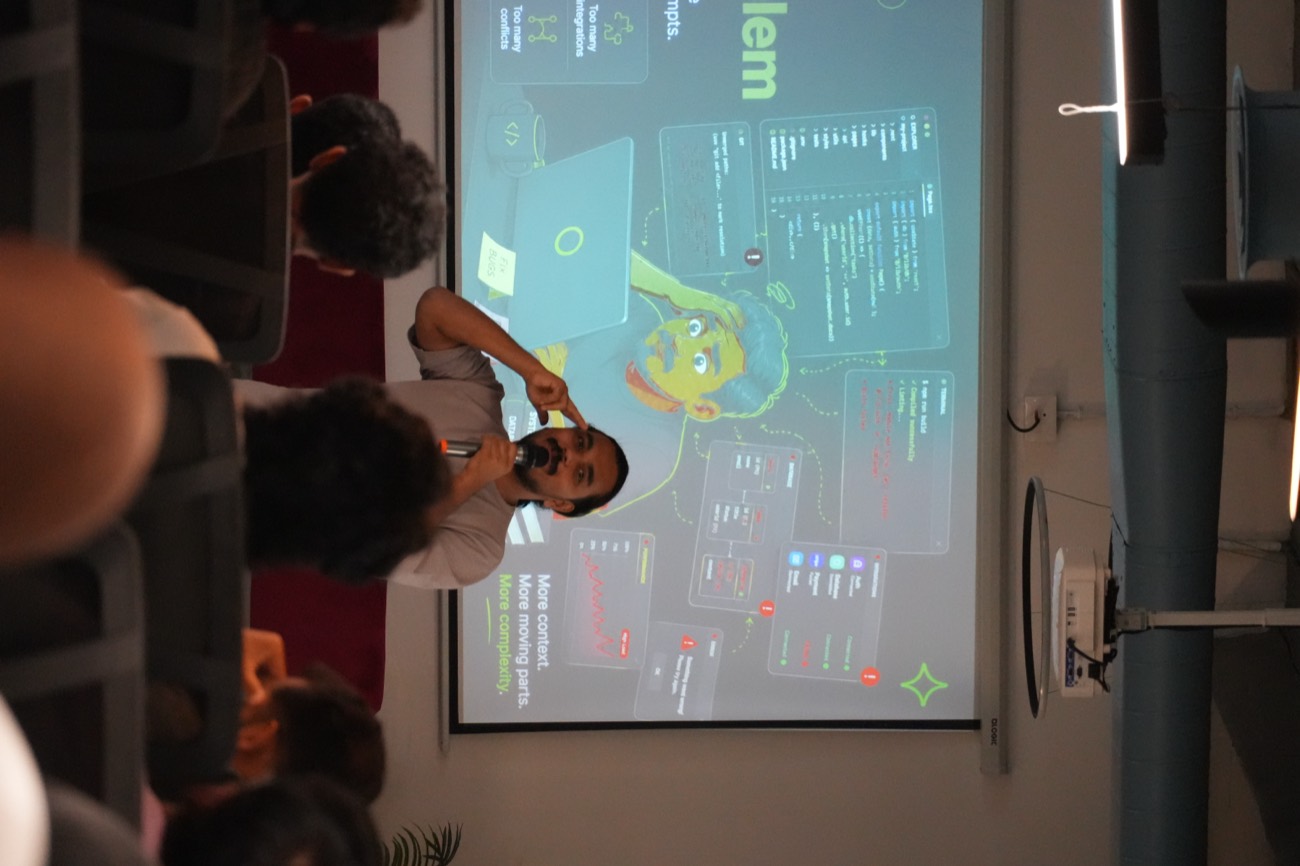 Speaker presenting an AI session with slides