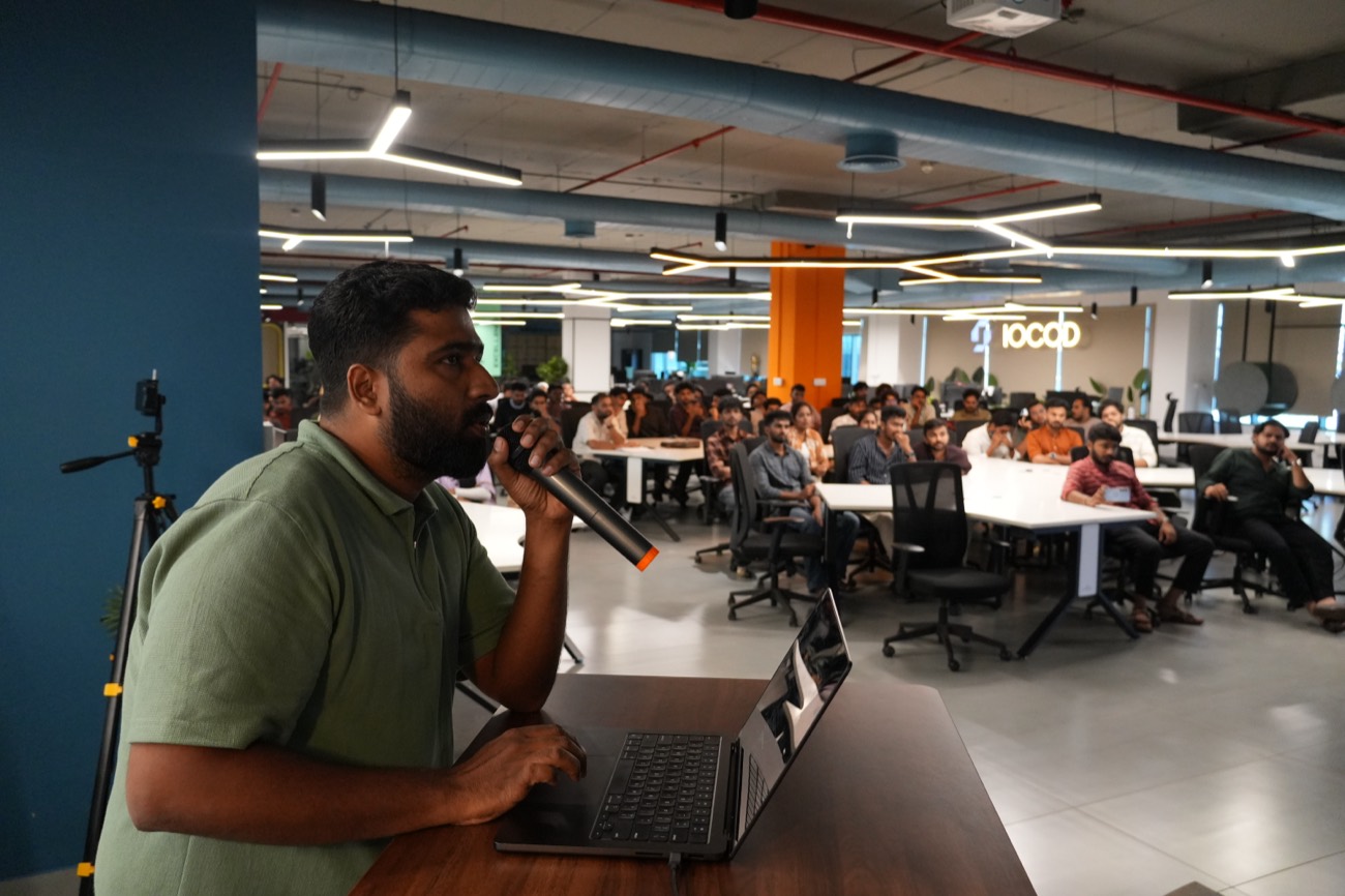 Speaker addressing the community with a live demo