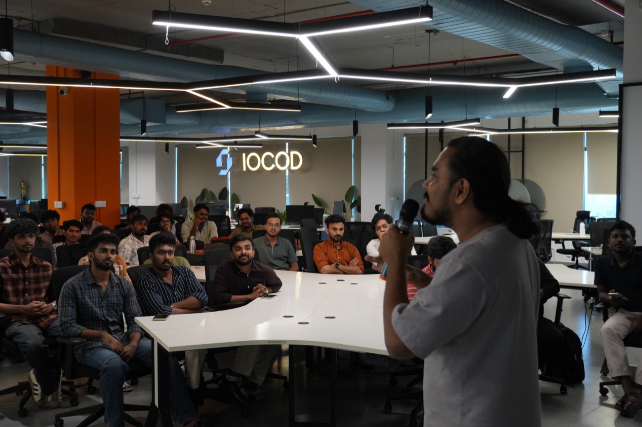 Speaker presenting a live demo with a laptop